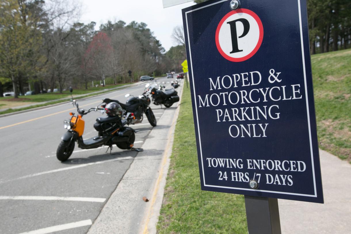 Park your moped or motorcycle in a designated area